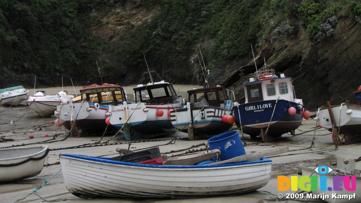 SX08777 Small boats on dry harbour floor in Newquay